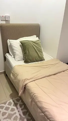 Single bed with upholstered headboard and mattress