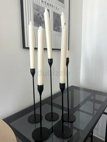 Black candle sticks with candles