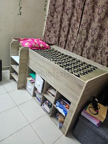 Used wooden loft bed with built-in shelves and storage