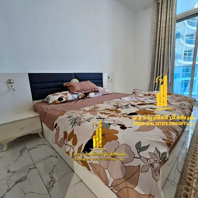 Luxury two-bedroom apartment with a sea view, furnished, with a gym, swimming pool and parking for rent in Ajman - Al Rashidiya 1 - Oasis Towers
