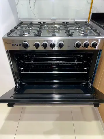 Stainless steel 5-burner gas cooker with oven - good condition