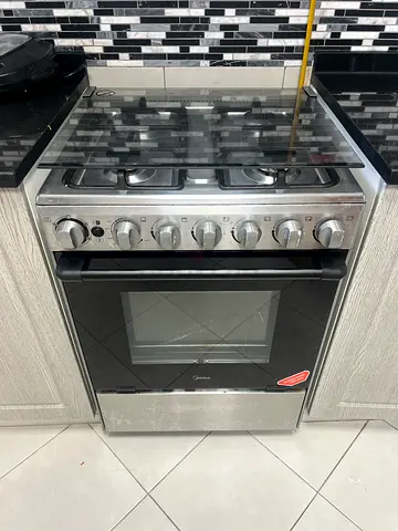 Used freestanding stainless steel gas range with oven - good working condition