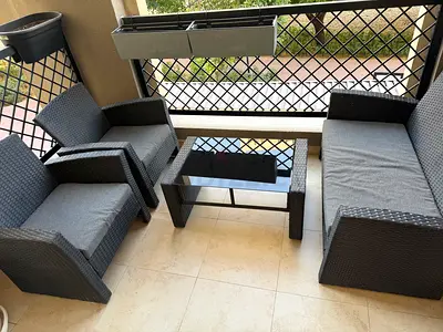 4-piece Outdoor Rattan Patio Sofa Set with Glass Coffee Table - Good Condition