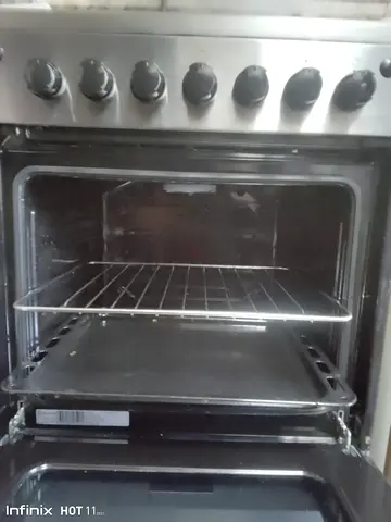 Used stainless steel freestanding gas oven with stovetop - working condition