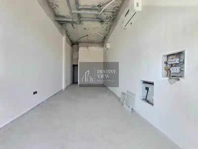 Title: 850 Sqft Commercial Shop for Rent in Hoshi | Prime Main Road Location | AED 65,000/year