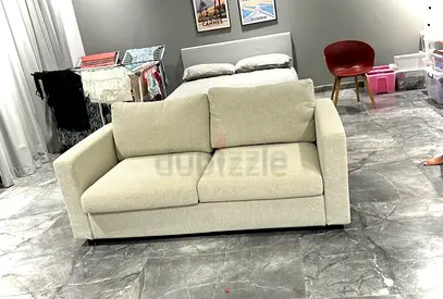 Light Beige 2-Seater Sofa - Good Condition
