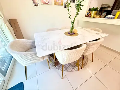 White Marble Dining Table with 6 Quilted Fabric Chairs
