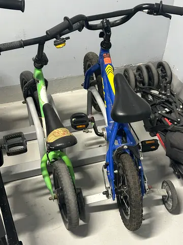 Two kids bicycles with training wheels (blue  green) - very condition