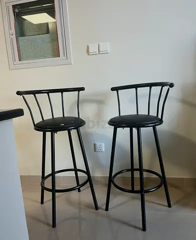 2 black steel high chairs