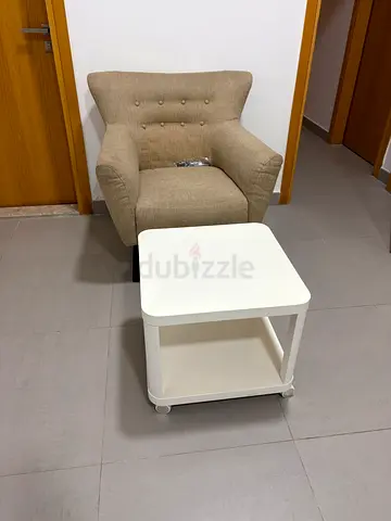 Beige Upholstered Accent Armchair with Small White Side Table
