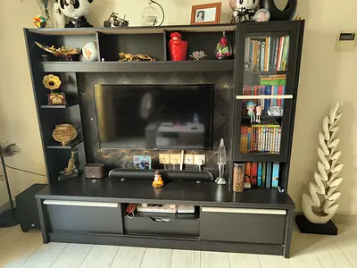 Dark Wood Entertainment Center with Shelves and Glass Door