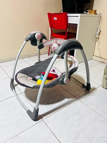 Baby bouncer/rocker with toy bar - good condition