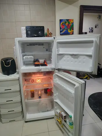 White double-door refrigerator in good working condition