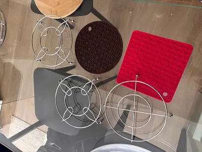 Set of metal trivets and silicone pot holders - used