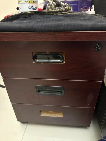 Three-drawer wooden bedside/storage unit - used