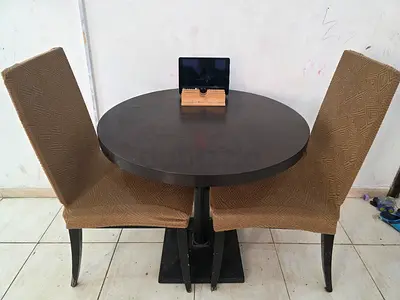 Round wooden dining table with 2 upholstered chairs - good condition