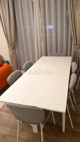 White minimalist dining table with 6 upholstered chairs - good condition
