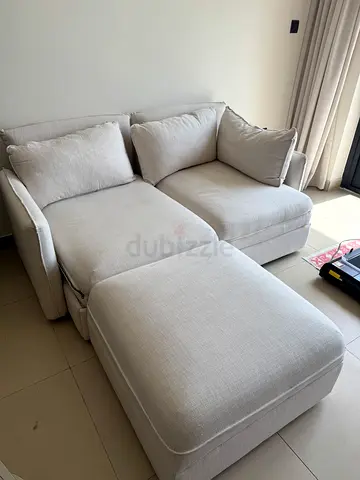Light beige 2-seater sofa bed in good condition