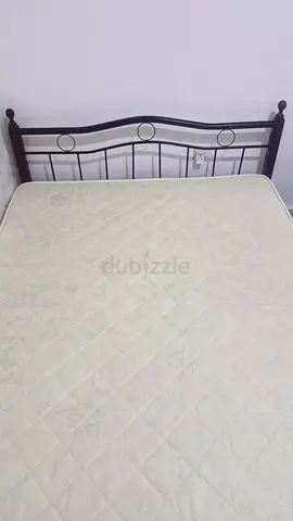 Queen metal bed frame with mattress (used)