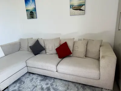 Light grey L-shaped fabric sofa - 3 seater with chaise