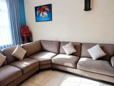 L-shaped Brown Fabric Sofa - Comfortable 4-seater Corner Sofa.
