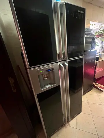Black Hitachi 4-Door Refrigerator with Water Dispenser - Good Condition. Price negotiable