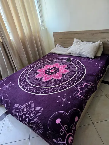 Purple Floral Plush Blanket on Queen Bed - Good Condition