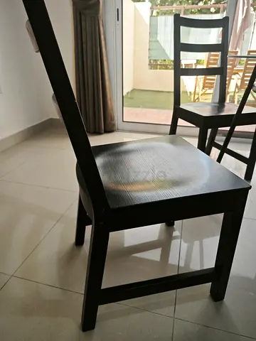 Set of 6 simple black wooden dining chairs — good condition