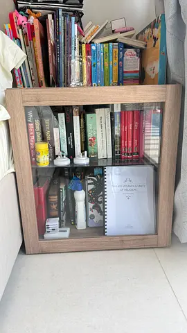Small wooden glass-front bookshelf
