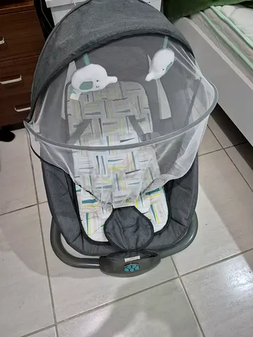 Baby rocker/infant bouncer with mosquito net and dangling toys - good condition