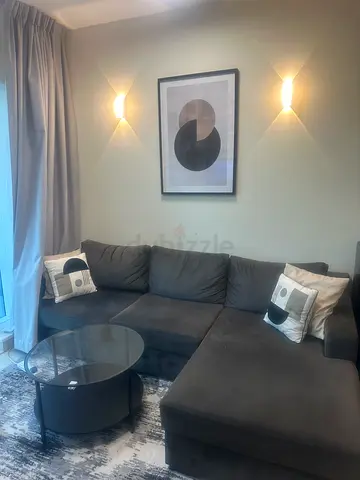 L shape Sofa couch With table and Artwork