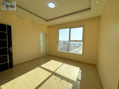 Two-bedroom apartment for annual rent in Ajman, with one month free and free parking. Located in Al Rawda 3, Sheikh Khalifa Street extension, next to