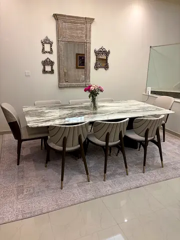 Marble dining table with 6 chairs from Al Huzaifa furniture located in jumeirah