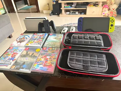 Nintendo Switch OLED Model with Accessories and Games (Good deal)