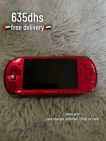 Red Sony PSP handheld with 128GB SD, charger and case