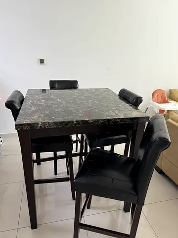 Square dining table with 4 black leather chairs
