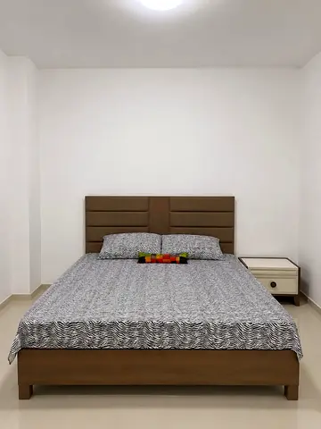 Wooden Double Bed with Padded Headboard — Good Condition