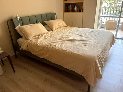 Queen-size bed frame with upholstered headboard