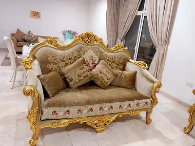 Classic Gold-Trimmed Two-Seater Sofa with Floral Upholstery