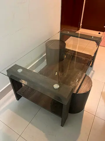 Modern glass-top coffee table with dark wood base