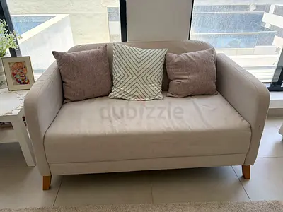 Light grey 2-seater sofa with cushions