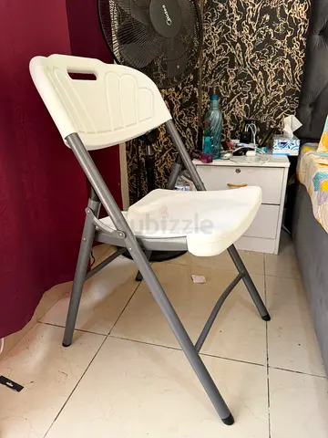 Small round wooden side table with white top