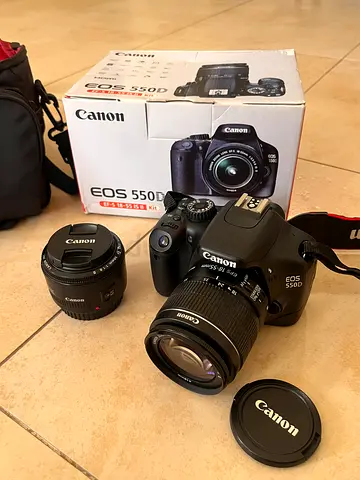 Canon EOS 550D DSLR with 18-55mm and 50mm lenses, with original box