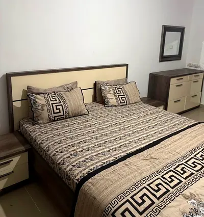 King size bed with matching bedside tables and dresser