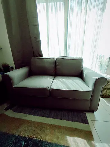 2-seater grey fabric sofa in good condition