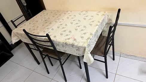 4-seater metal dining table with chairs (used) - compact set