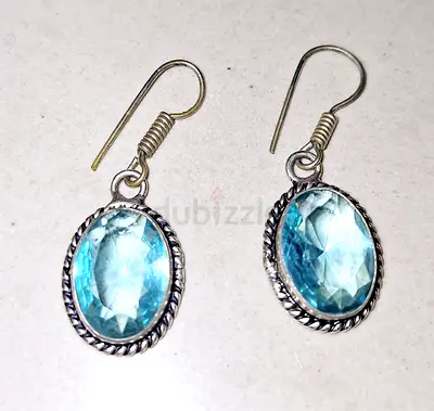 Silver earrings with blue topaz