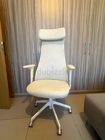White IKEA ergonomic office chair with headrest and armrests