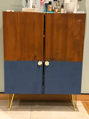 Mid-century small wooden cabinet with blue doors and gold legs