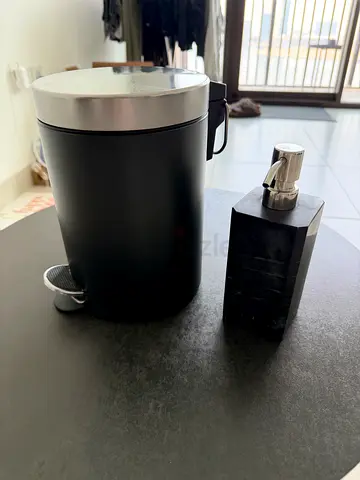 Small black pedal bin with matching soap dispenser